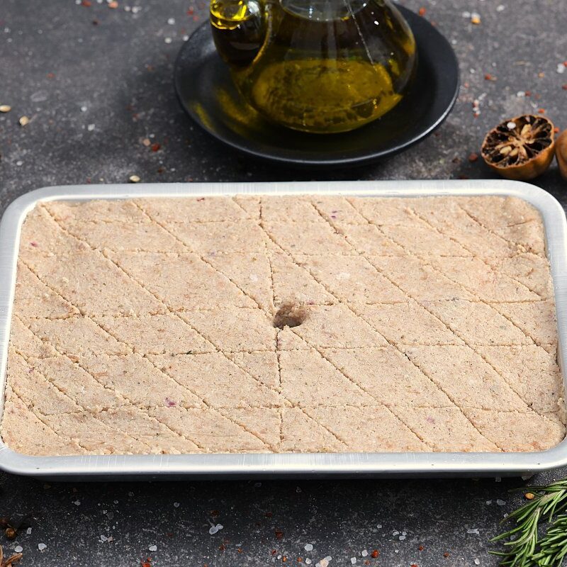 Raw kafta minced meat pressed flat in a tray with diamond scoring - fresh from The Meat Master Butchery