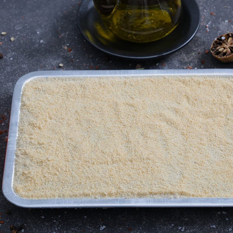 Fine semolina-coated kibbeh base pressed in a tray ready for preparation - The Meat Master Butchery