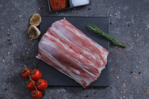 Rack of fresh raw lamb ribs with rosemary and dried garlic - The Meat Master Butchery