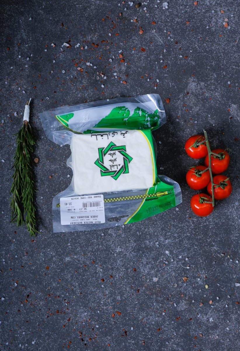 White cheese block in vacuum packaging with green label - fresh dairy at The Meat Master Butchery